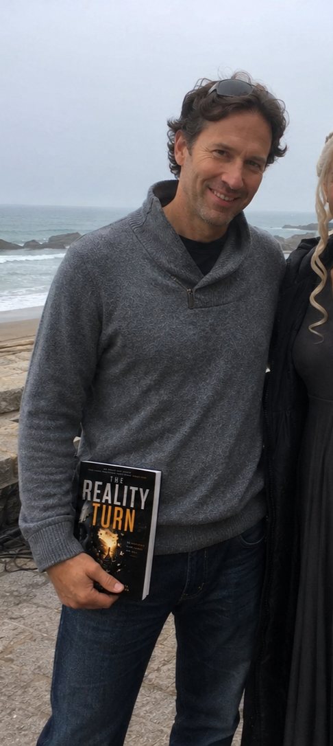 A reader holding The Reality Turn